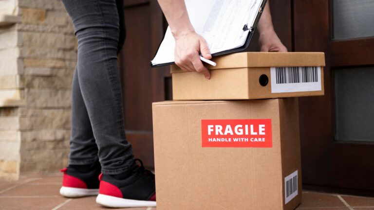 Movers packing and loading furniture for home shifting in Dubai