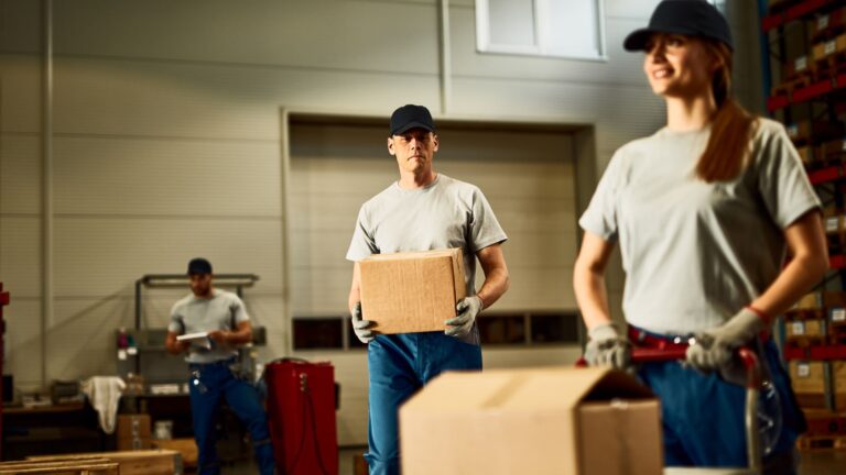 Moving truck and workers loading household items in Dubai